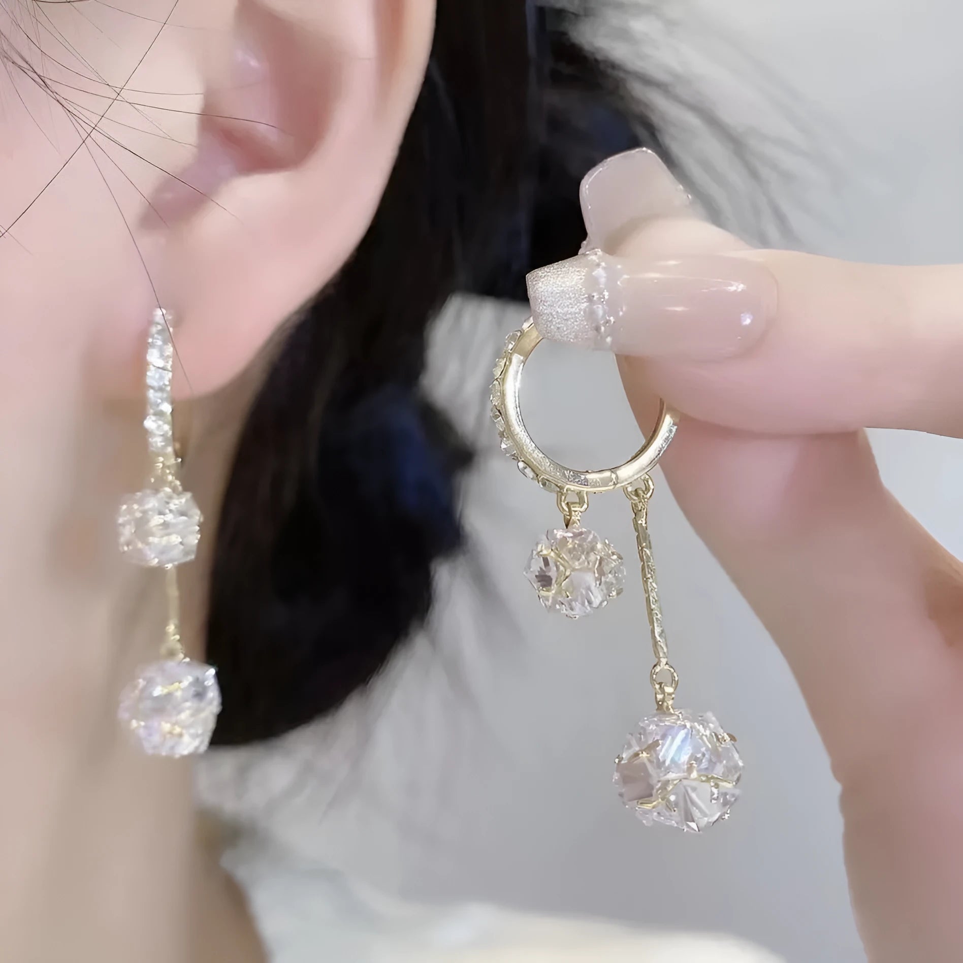 Silver tassel ball earrings with confession balloon pendant and rhinestone details on ear clips
