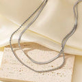 Women's retro double-layer twist necklace with geometric pendant on snake bones chain