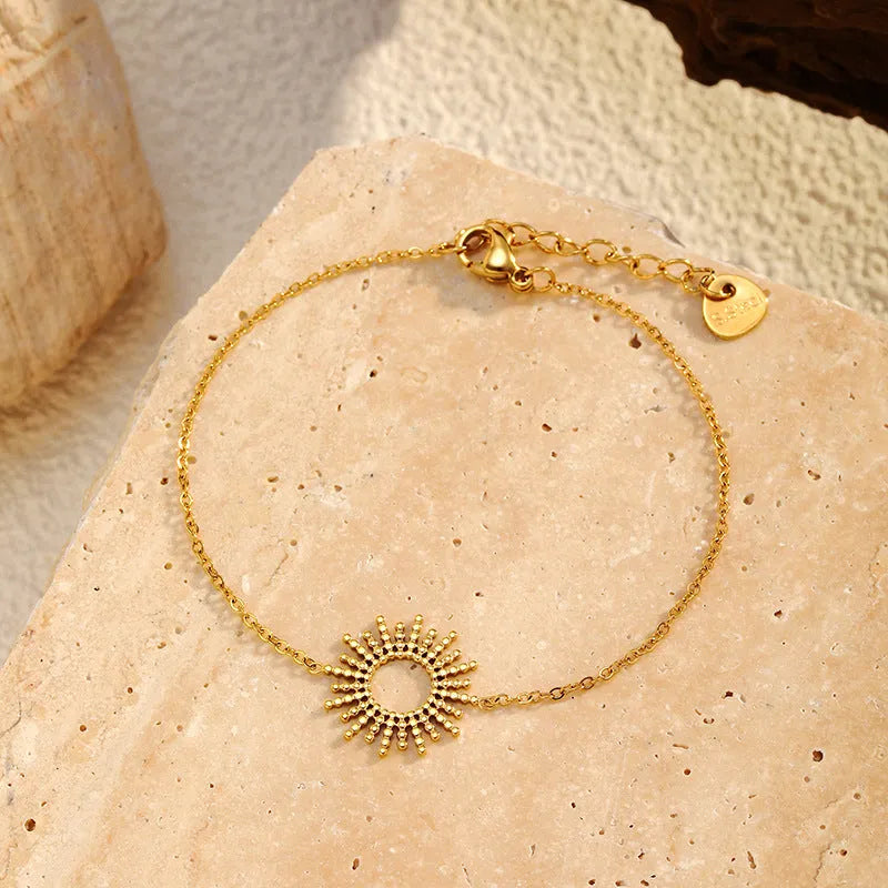 Sunflower pendant necklace and bracelet set in gold-plated stainless steel with geometric chain links