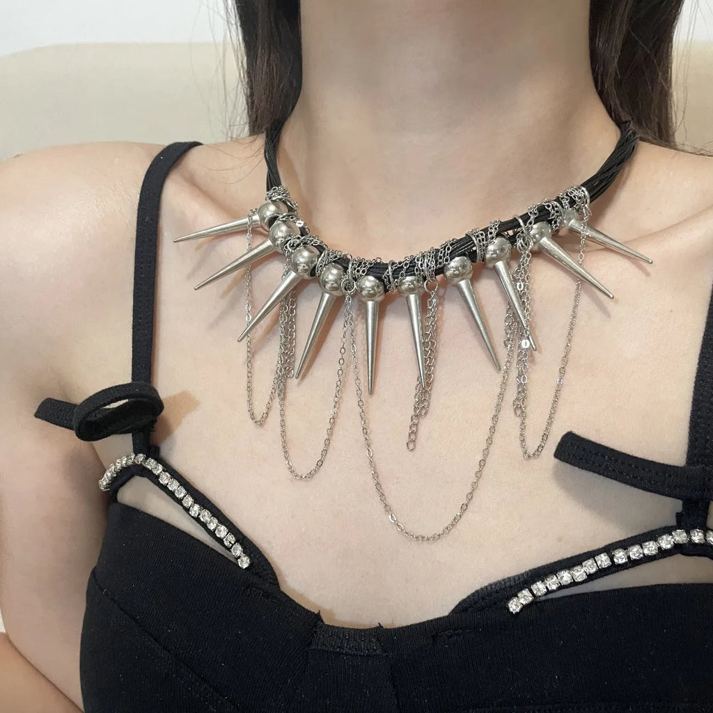 Women's leather necklace with winding tassel, round beads, and metal rivet details