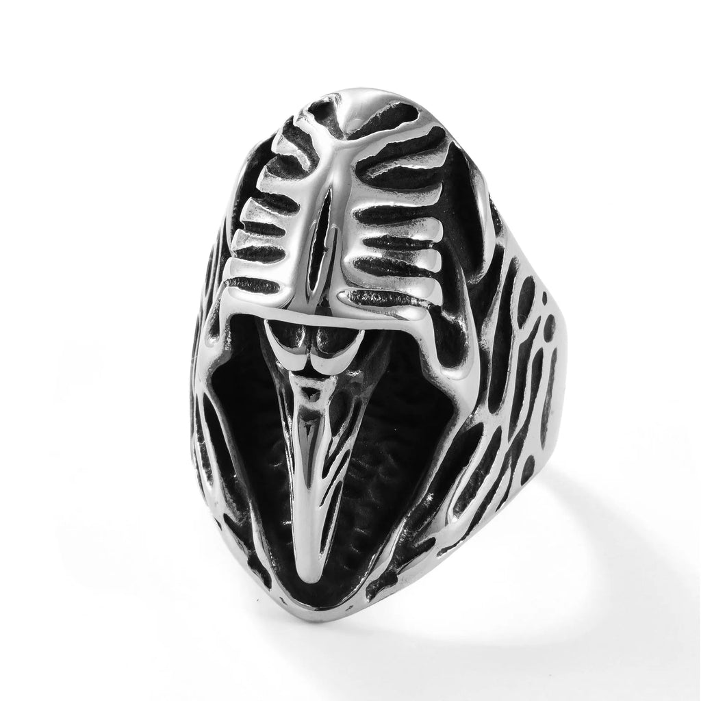 Stainless steel crow punk ring with geometric design on grey background