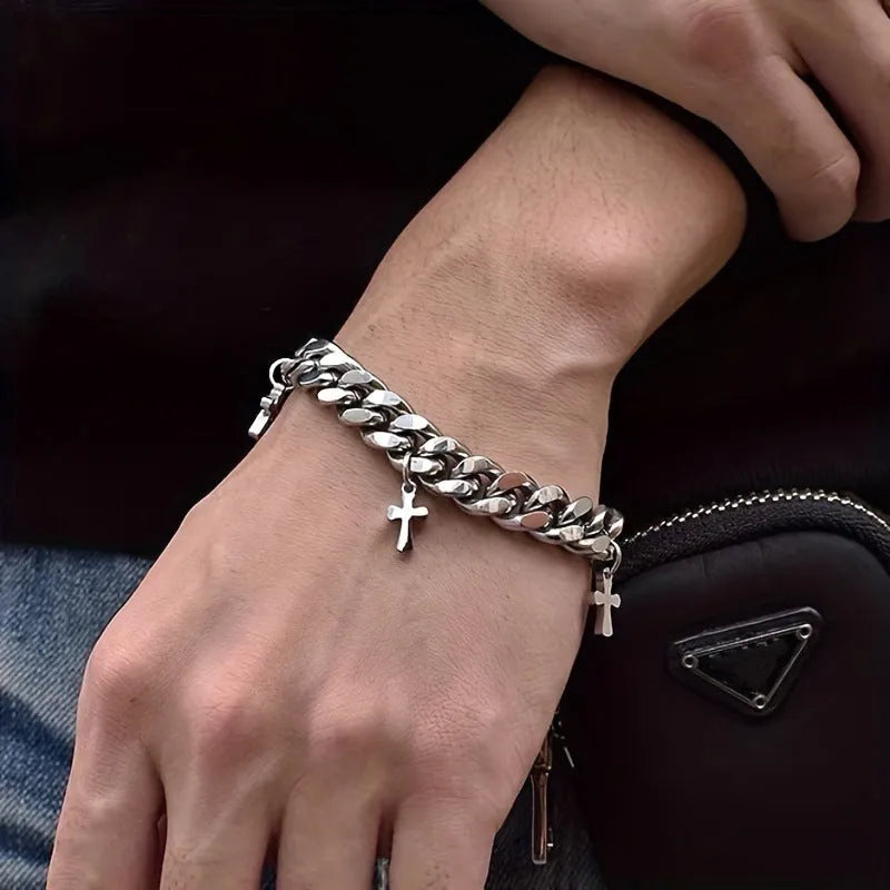 Men's titanium steel bracelet with a geometric shape and cross design on a wrist.