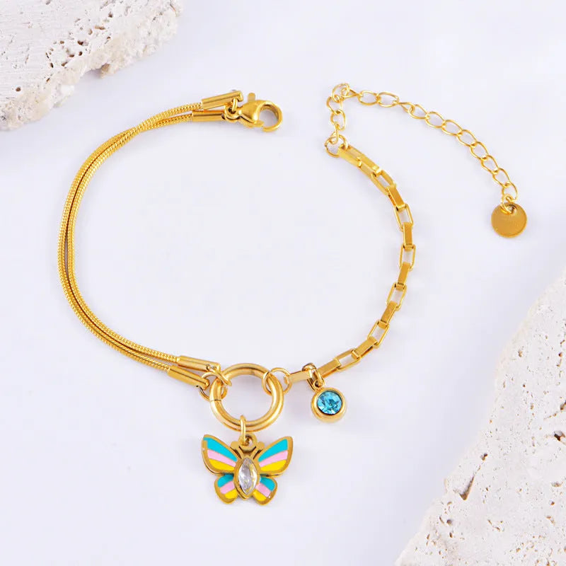 Gold titanium steel jewellery set with colourful epoxy butterfly pendant designs