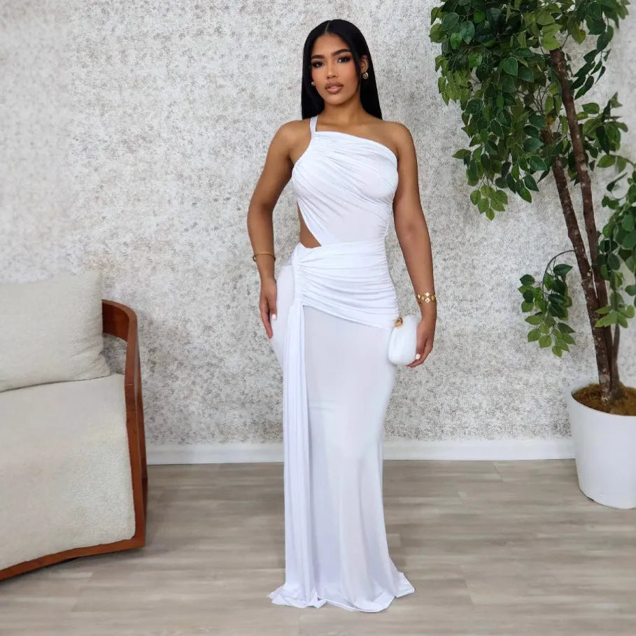 Women's solid colour long dress with one shoulder strap and pleated skirt in white, orange, or green.
