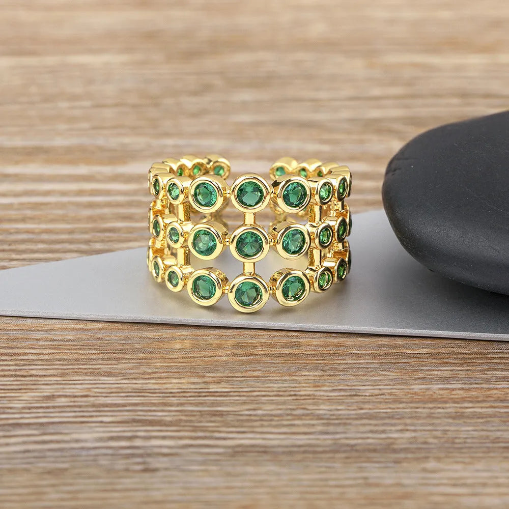 Copper wide band ring with 18K gold plating and full green zircon stones