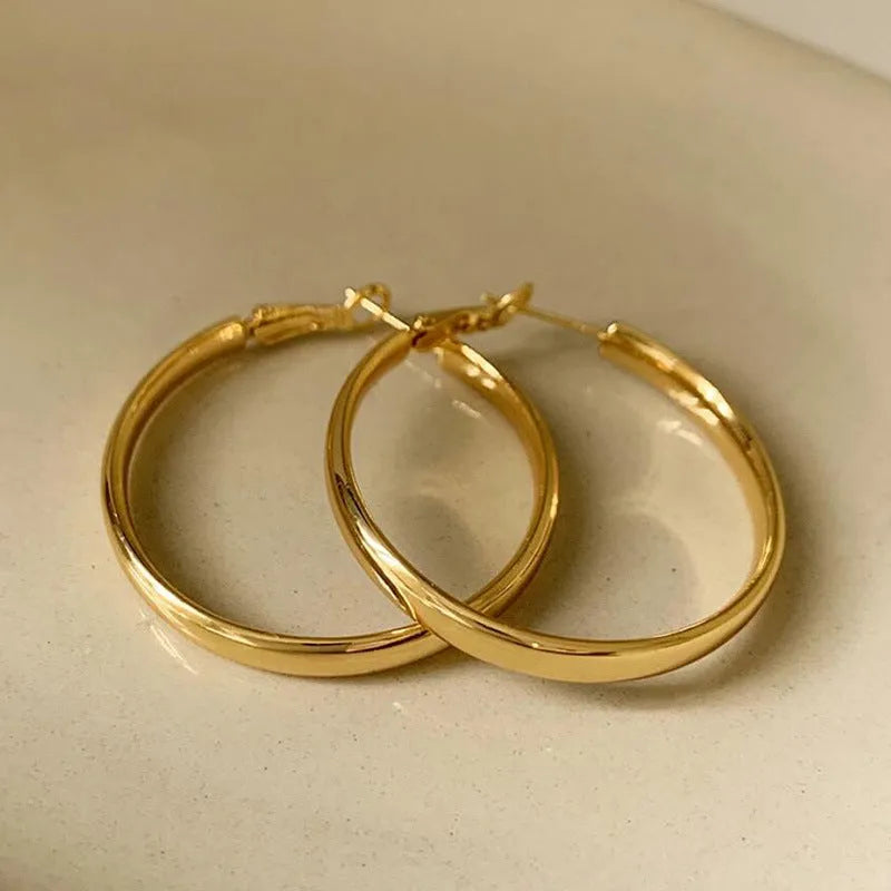 Gold and silver metal circle hoop earrings with 40mm diameter electroplated copper construction