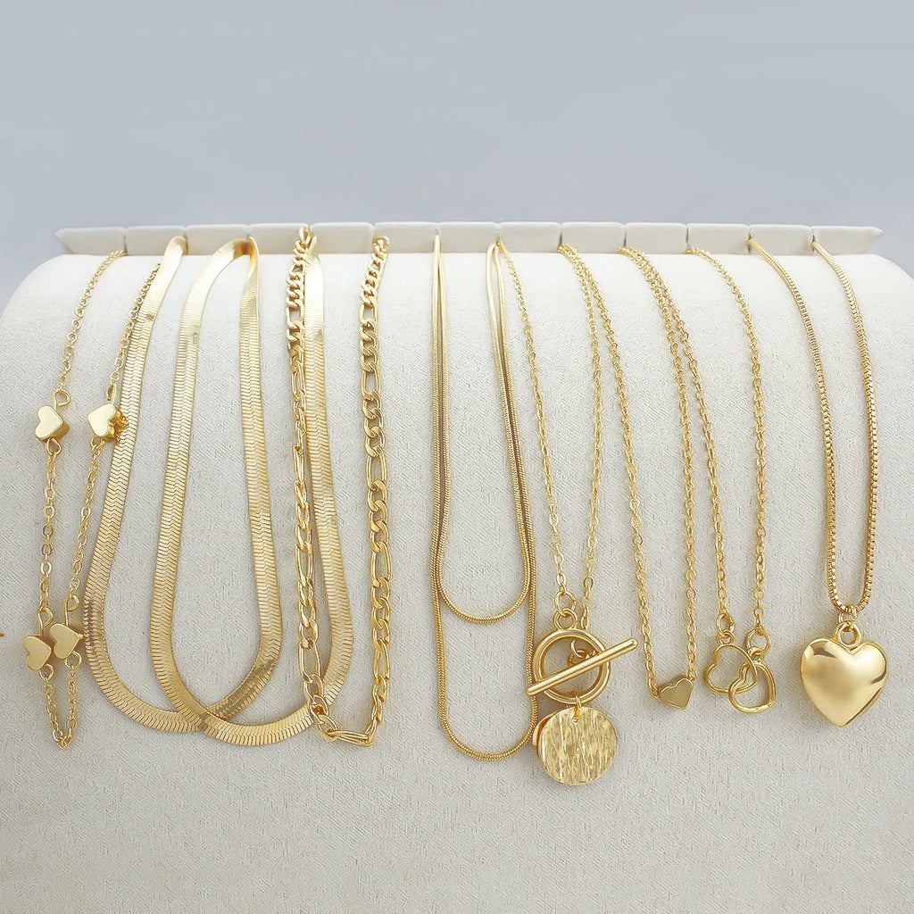 10-piece gold women's necklace set with alloy pendants on adjustable snake bones chain jewellery collection