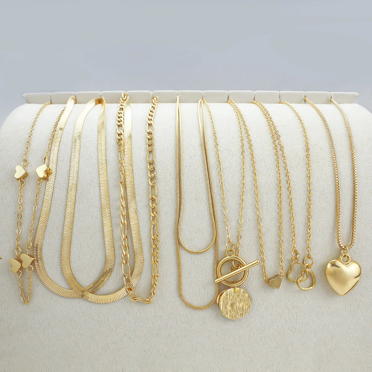 10-piece gold women's necklace set with alloy pendants on adjustable snake bones chain jewellery collection