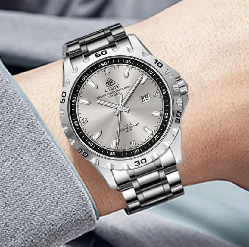 Men's silver quartz watch with luminous hands and stainless steel strap on grey dial