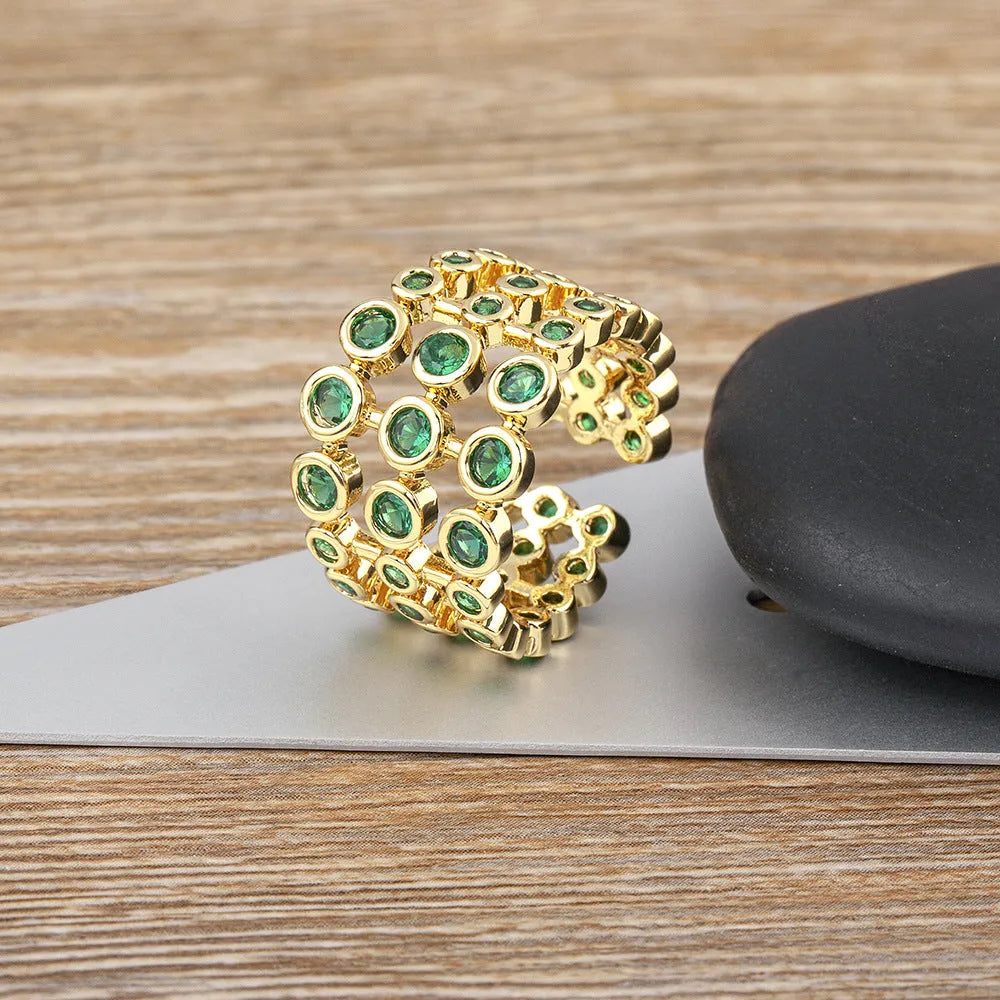 Copper wide band ring with 18K gold plating and full green zircon stones