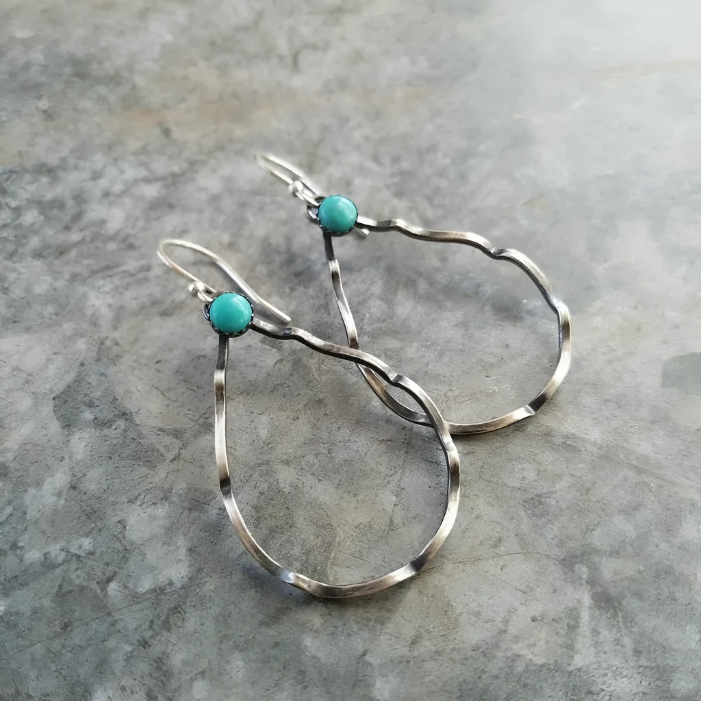 Circular turquoise earrings in antique silver with bohemian geometric design