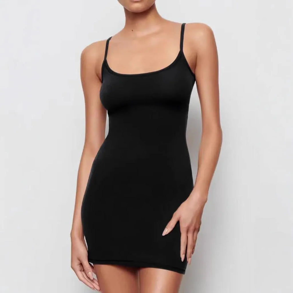 Black sleeveless sling-style sheath dress with a short skirt on a hanger.