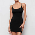 Black sleeveless sling-style sheath dress with a short skirt on a hanger.