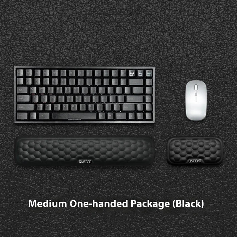 Memory foam mouse wrist pad with silicone bottom in black cloth cover on computer desk