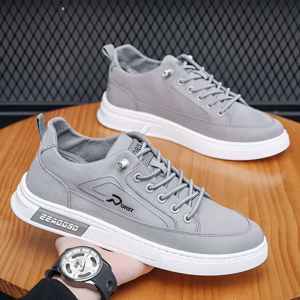 Grey men's canvas casual shoes with lace-up front and decorative stitching details