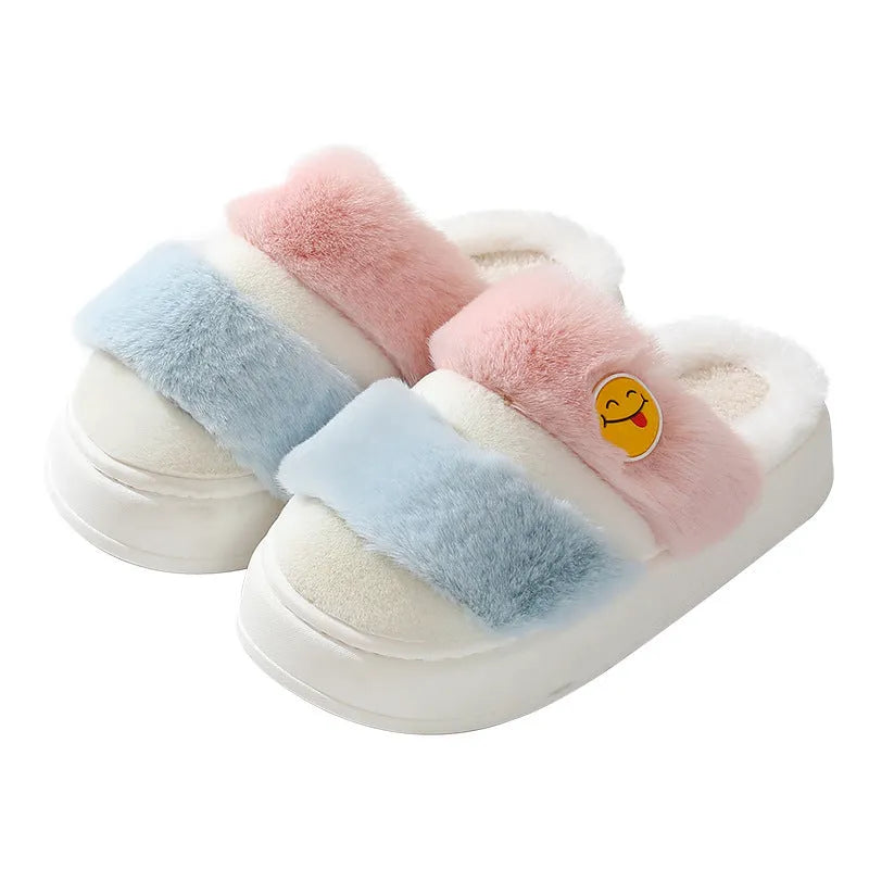 Pink and blue thermal cotton slippers with plush upper and cashmere lining, shown on a foot.
