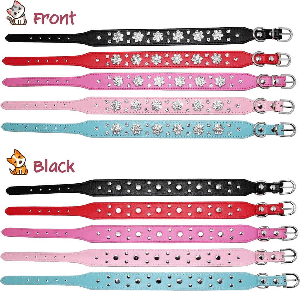 Close-up of a black PU leather dog collar with silver rhinestone flowers and studs, showing the metal D-ring.