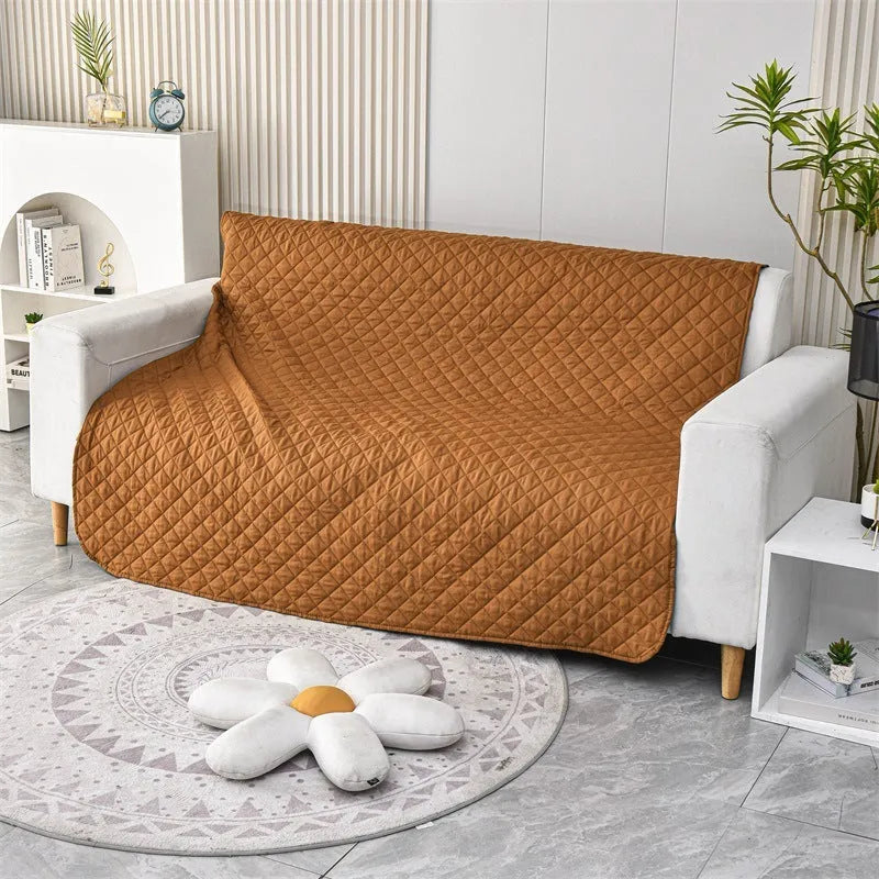 Reversible dog blanket and sofa cover in waterproof washable fabric, showing two colour sides.