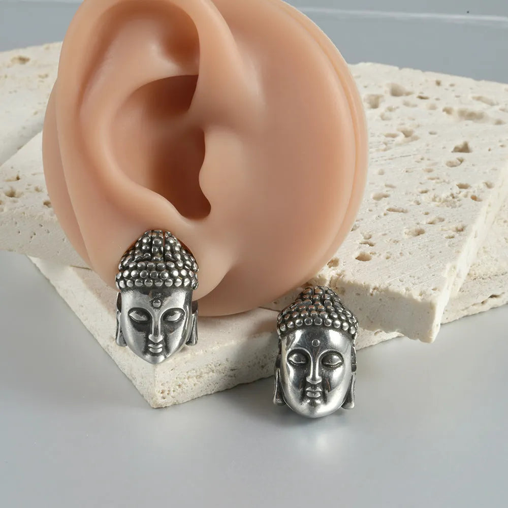 Stainless steel hollow skull Buddha earrings with geometric design in hip hop style