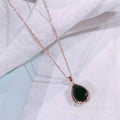 Women's water drop necklace with rose gold rhinestone and pink alloy gemstone pendant.