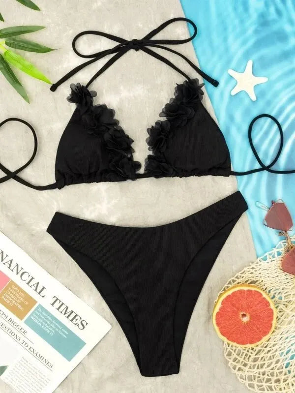 Black gathered design women's swimwear set with bikini top and shorts on mannequin