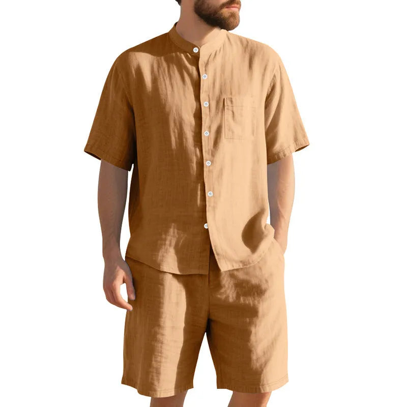 Men's light blue linen two-piece suit with short-sleeved henry collar shirt jacket and shorts on a hanger.