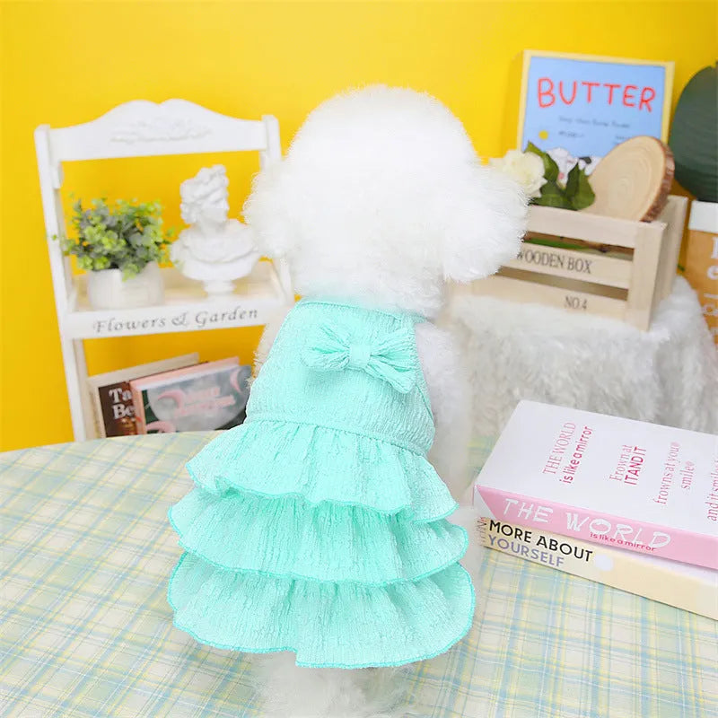 Small dog wearing polyester princess dress with layered candy skirt in rose red colour