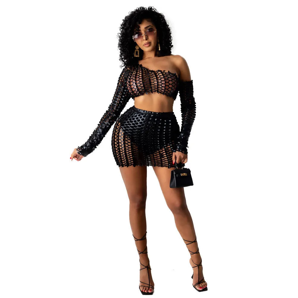 Women's black sleeveless hollow-out two-piece dress set with a short skirt.