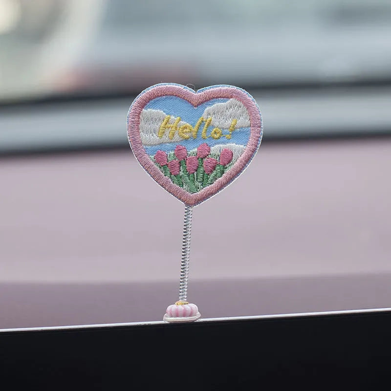 Set of six small yellow PVC duck figurines and one plastic sign for car dashboard decoration.