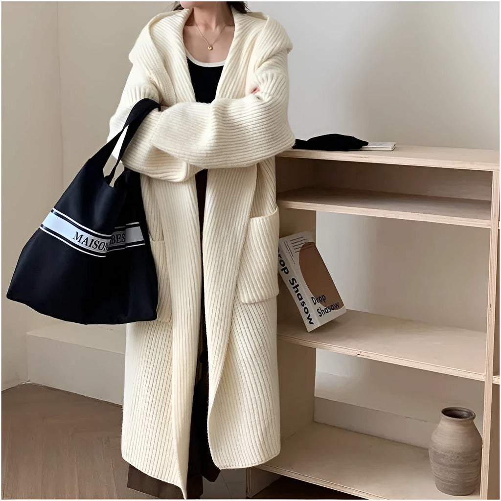 Loose hooded cardigan coat with raglan sleeves in acrylic fabric showing extended length