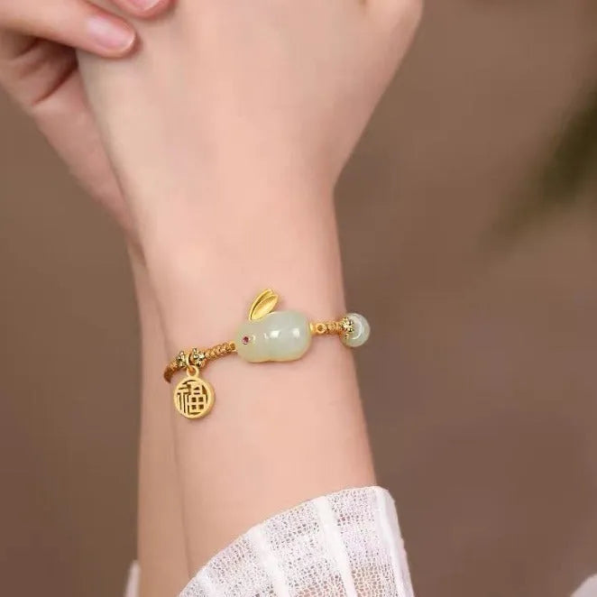 Hetian jade rabbit charm bracelet for women on a yellow string fastening