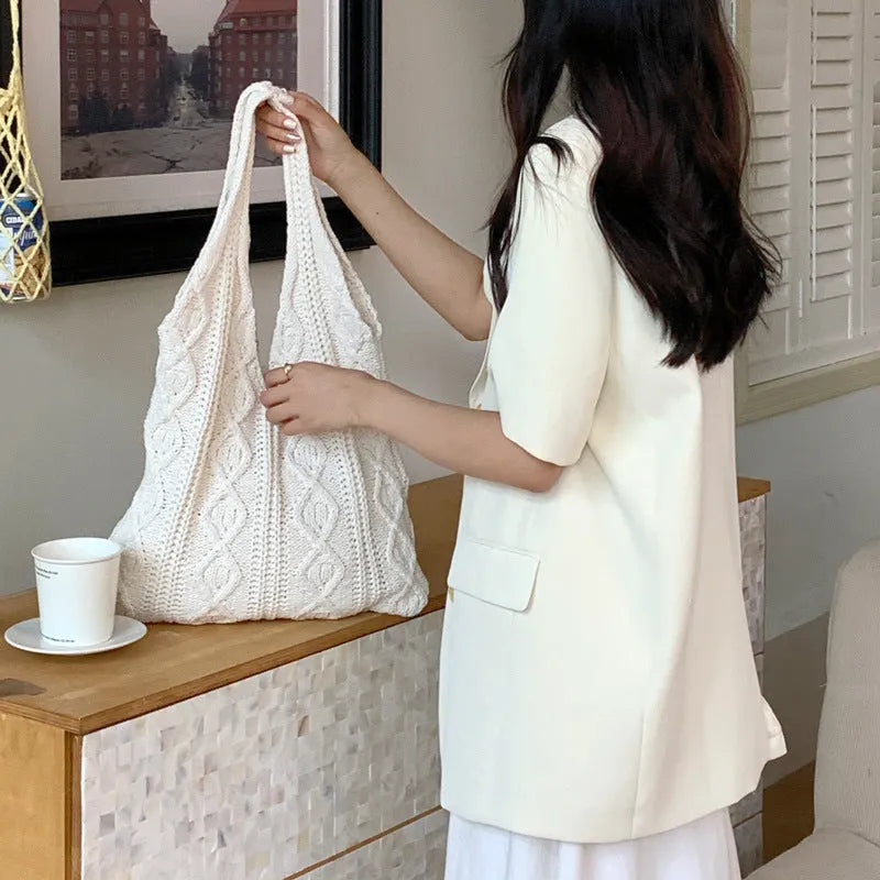 Women's retro hollow knitted woolen yarn shoulder tote bag in a solid colour with double straps.