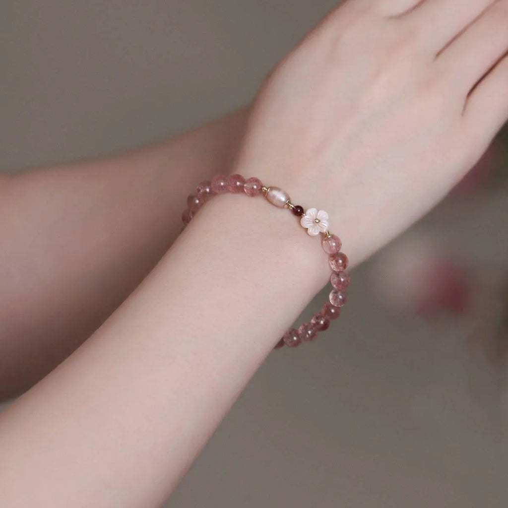 Crystal floral bracelet with strawberry quartz peach blossom colour on wrist