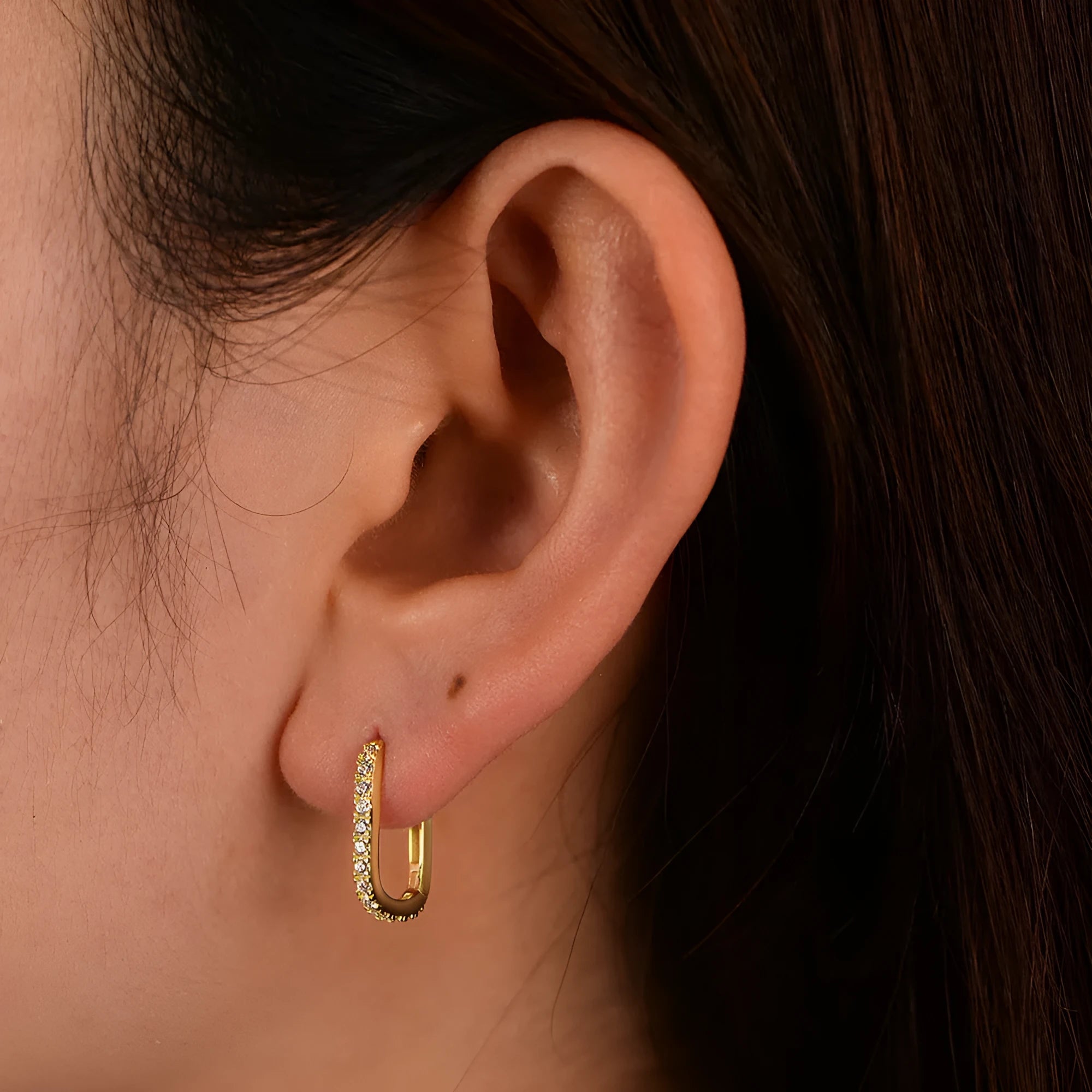 Sterling silver oval zircon ear clips with geometric design in yellow or white silver finishes