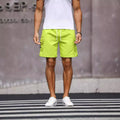 Men's loose fit street style work shorts in fluorescent green and army green colours.