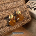 Three pairs of handmade geometric earrings with tassel details in gold electroplated finish