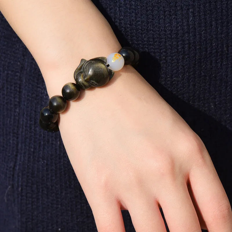 Natural obsidian bracelet with zodiac guardian design and 10mm stone beads