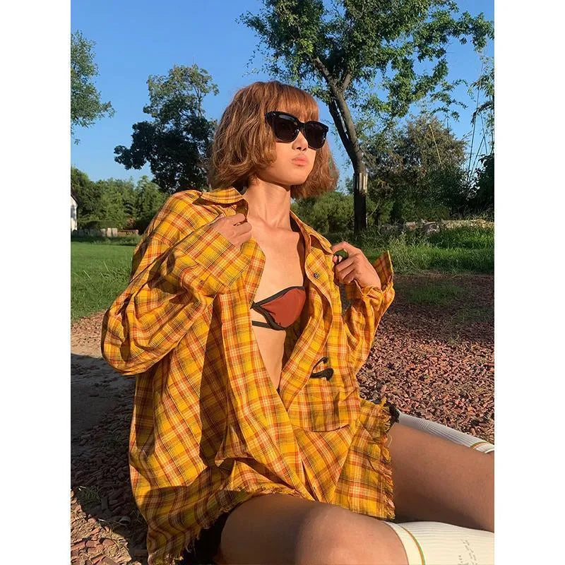 Loose-fitting dopamine yellow plaid cardigan-style shirt on a hanger