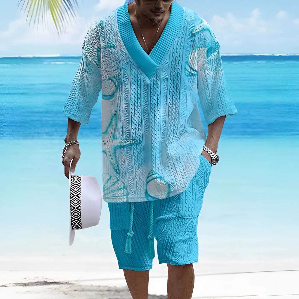 Man wearing a loose-fitting light blue short sleeve top and matching shorts casual suit set.