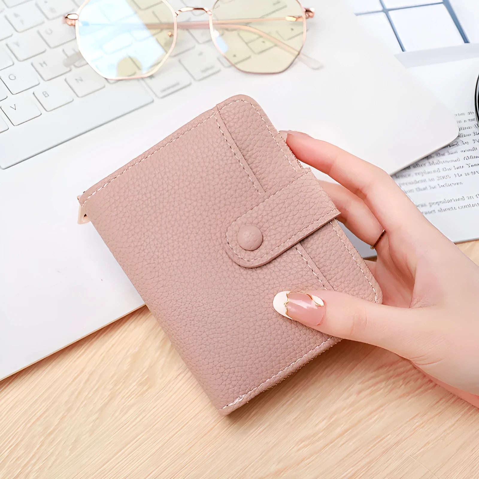 Ladies short wallet in PU leather with a lychee pattern, shown folded, in beige, pink, black, and red colour options.