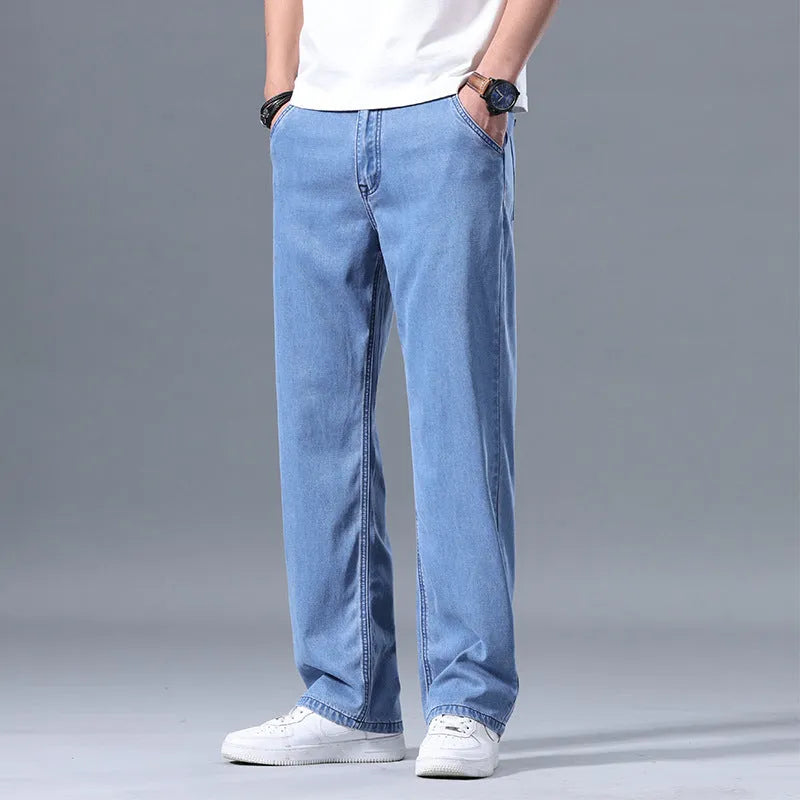 Men's loose straight-leg lyocell jeans in light blue, shown with a zipper fly.