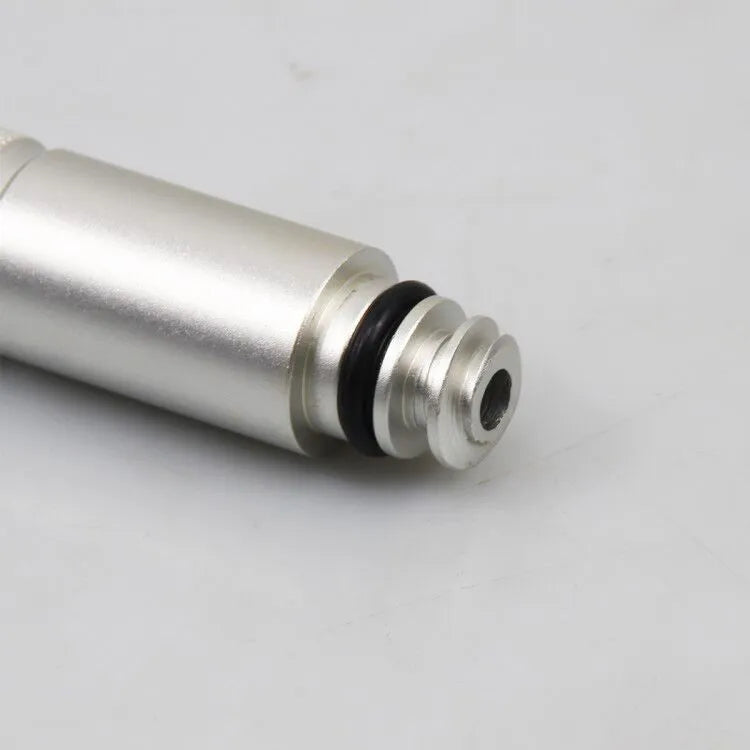 Silver metal transmission refuelling joint for automotive workshop use.