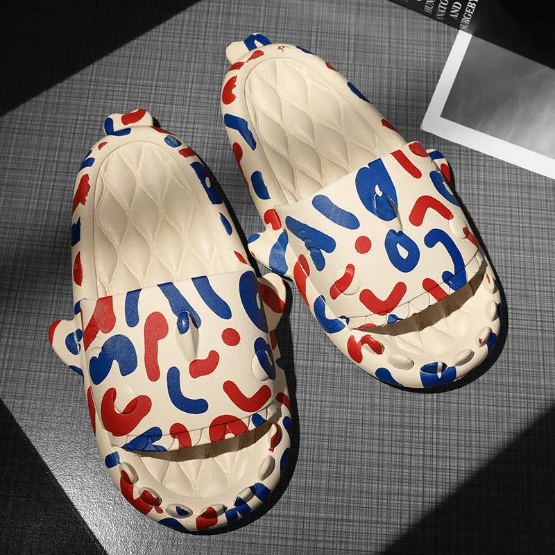 Pair of grey shark design open toe EVA home slippers on a white background.