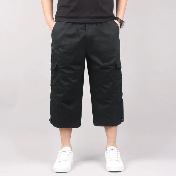 Men's loose fit cotton cropped casual pants in khaki colour on a neutral background.
