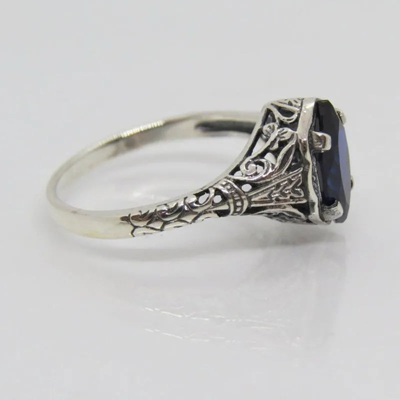 Silver geometric hollow alloy ring with zircon detailing shown in women's sizes 5 to 11