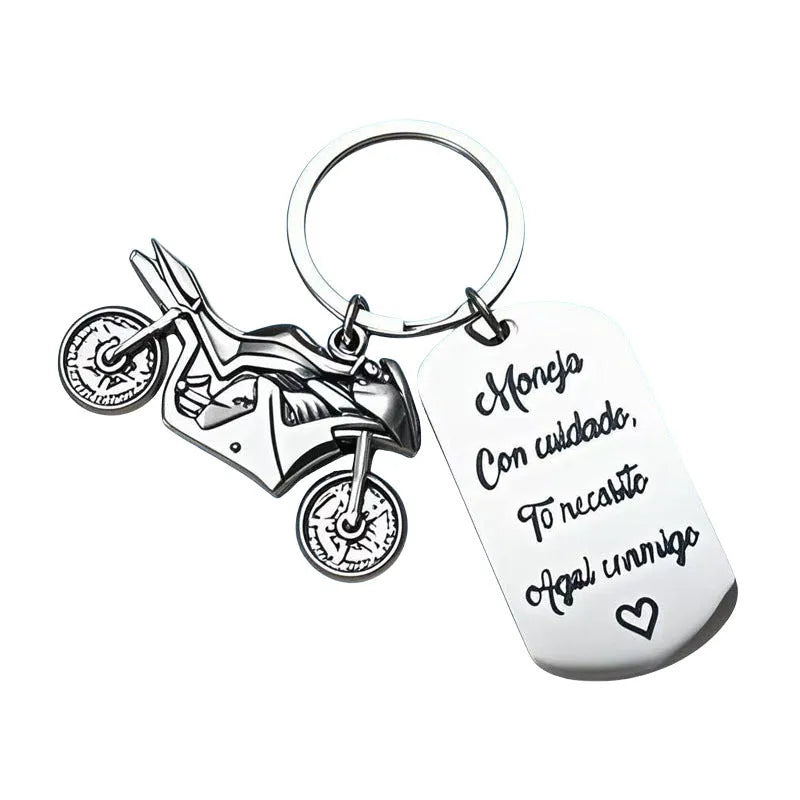 Stainless steel motorcycle keychain with inspirational text and a flannel storage bag.