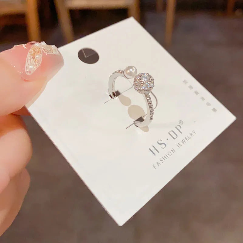 Women's open-end ring with round zircon stones in gold and silver plating options