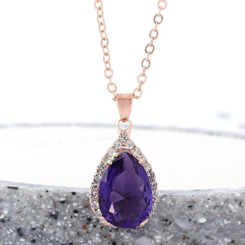 Women's water drop necklace with rose gold rhinestone and pink alloy gemstone pendant.