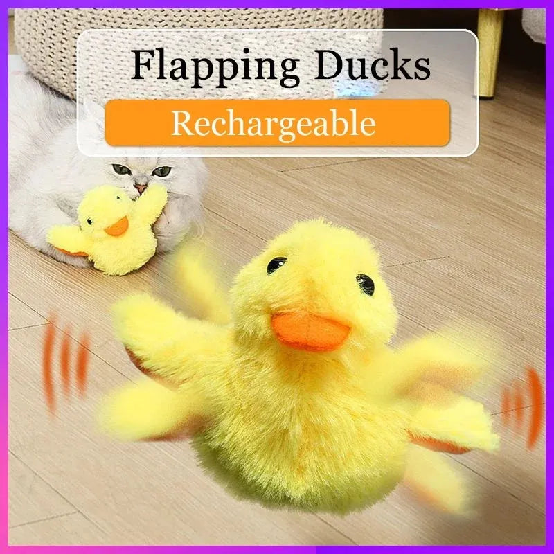 Yellow flapping duck cat plush toy with vibration sensor and USB charging cable on a neutral background.