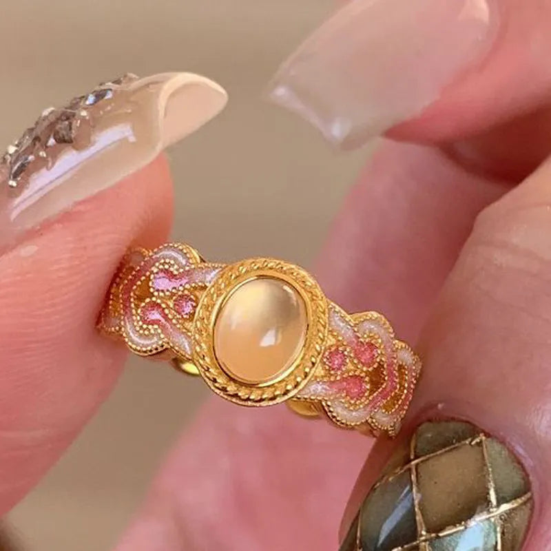 Women's pink crystal enamel adjustable ring with geometric open design on gold-plated copper